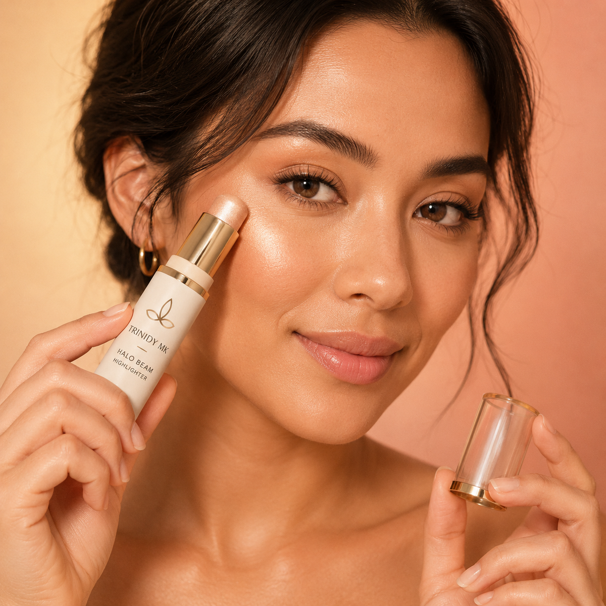 Trinidy MK Halo Beam Highlighter Stick shown in a softly glowing cheek application scene